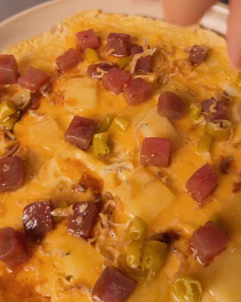 The ‘lazy’ tortilla up close, with diced bluefin tuna, piparra peppers and a crispy anchovy
