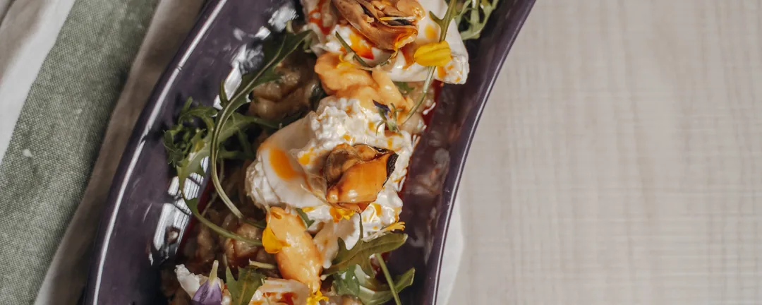 The aubergine with spiced yoghurt, rocket and flowers